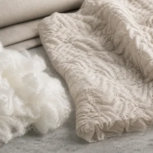 Brand-neutral representative image of high-shrinkage polyester staple fiber and textured fabric